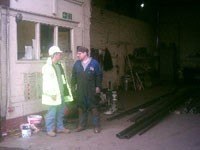 Contracts manager &  fabricator discuss an ongoing project